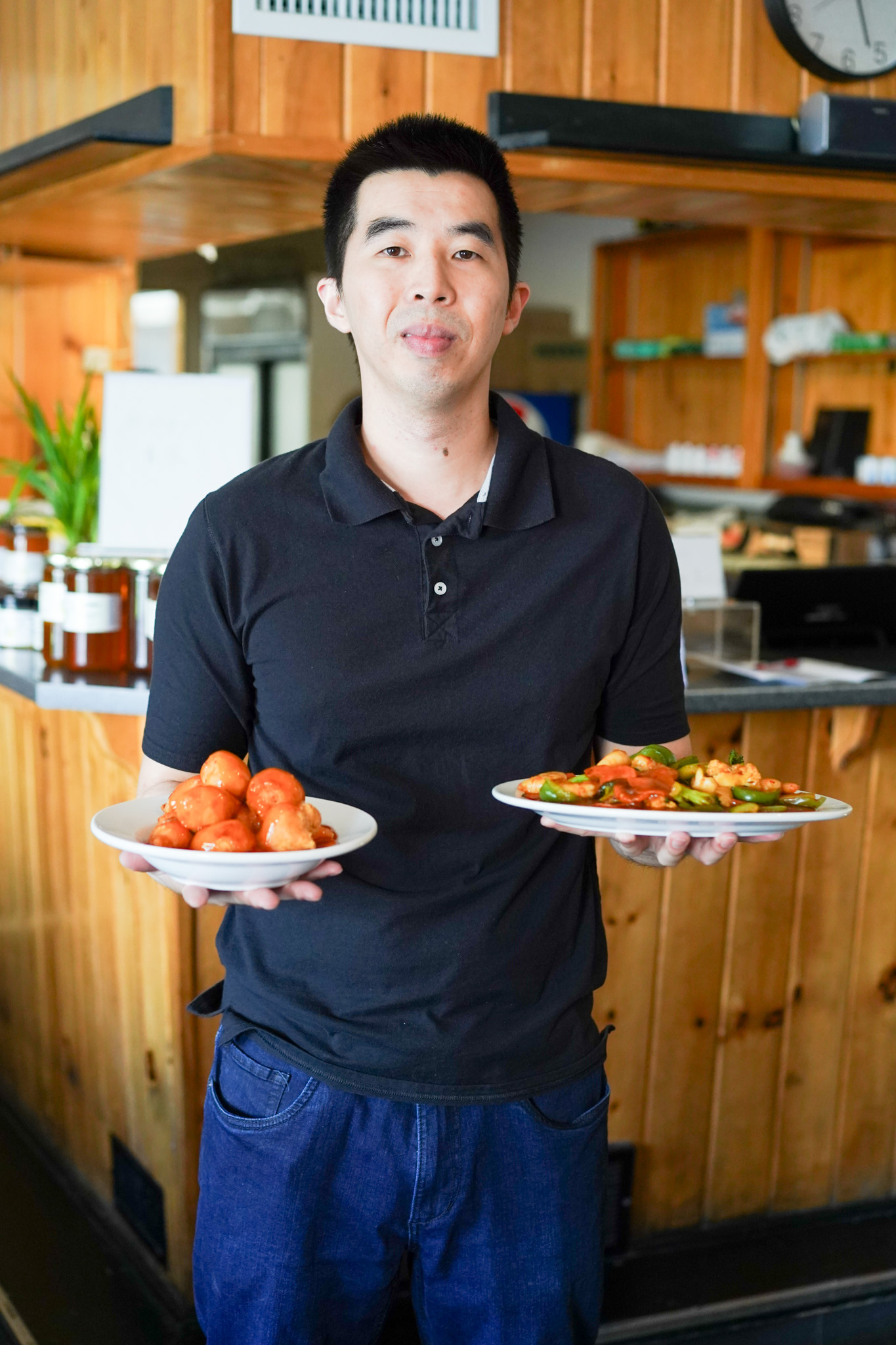 Riverside Restaurant team member serving plates